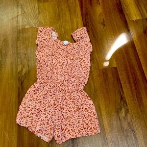 Summery romper with orange and pink flowers